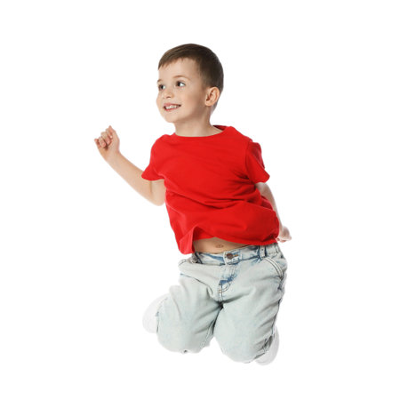 Happy little boy dancing on white backgroundの写真素材