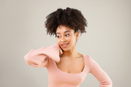 Portrait of beautiful Brazilian woman on gray backgroundの写真素材