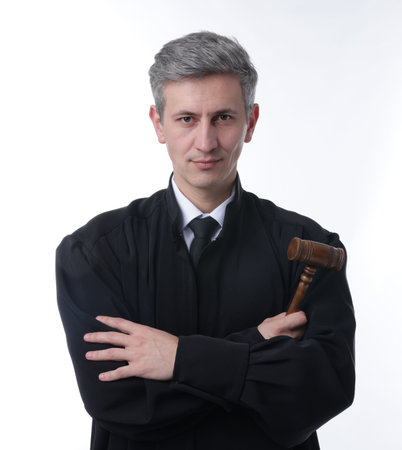 Judge with mallet in court dress on white background