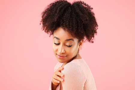 Portrait of beautiful Brazilian woman on pink background