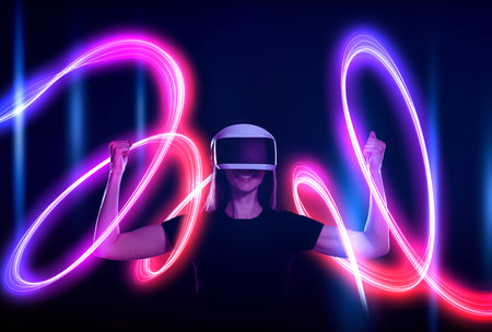 Woman using virtual reality headset on dark blue background. Bright neon line around her