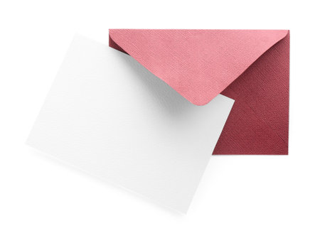Blank invitation card and envelope isolated on white, top view. Space for design