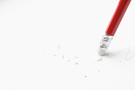 Using pencil with eraser on white background, closeup. Space for textの写真素材