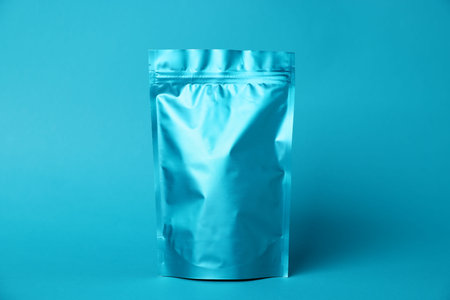 One zipper stand-up pouch on light blue background. Mockup for design