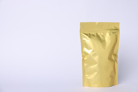 One zipper stand-up pouch on light gray background. Mockup for designの写真素材