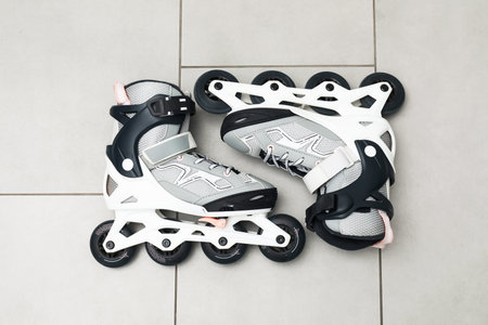 Pair of roller skates on floor, top view