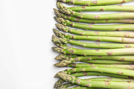 Fresh ripe raw asparagus on white background, flat layの写真素材