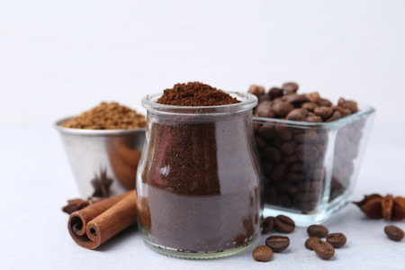 Different types of instant coffee, beans and spices on light table, closeupの写真素材
