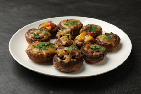 Tasty stuffed mushrooms on black table, closeupの写真素材