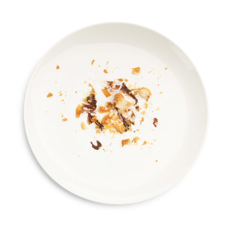 Dirty plate with crumbs and sauce isolated on white, top viewの写真素材