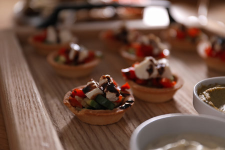 Buffet menu. Tasty stuffed tartlets on table, closeupの写真素材