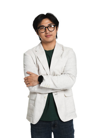 Portrait of handsome Asian man in glasses with crossed arms on white background
