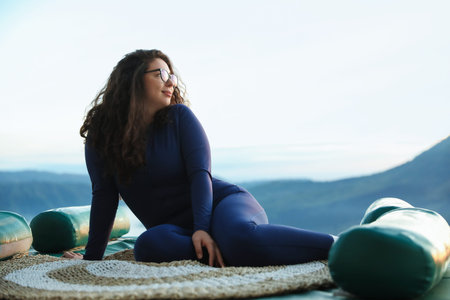 Beautiful woman enjoying picturesque view of mountains. Space for text