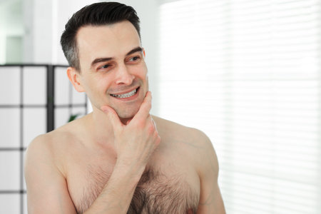 Portrait of smiling man after shaving at homeの写真素材