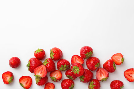 Fresh ripe strawberries on white background, flat lay. Space for textの写真素材