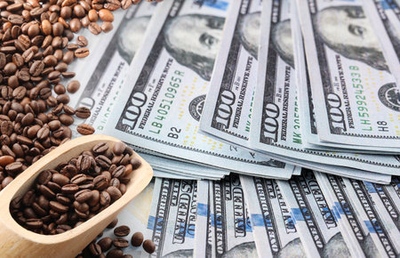 Rising coffee price. Roasted beans and dollar bills, double exposureの写真素材
