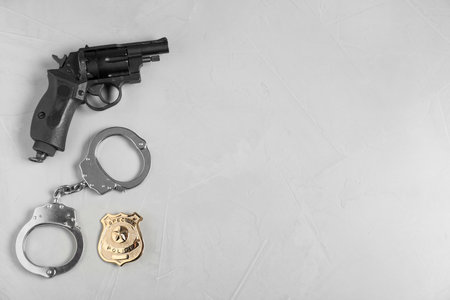 Different police equipment on light gray table, flat lay. Space for textの写真素材