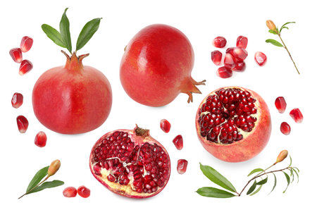 Pomegranate fruits and green leaves isolated on white, setの写真素材
