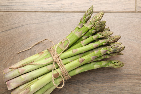 Fresh raw asparagus spears on wooden table, top viewの写真素材