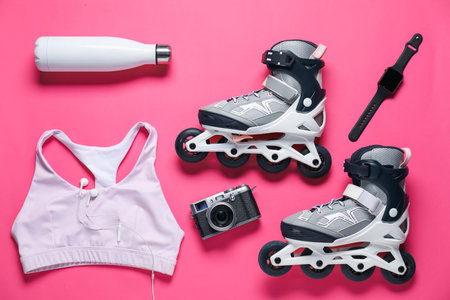 Flat lay composition with roller skates on pink backgroundの写真素材
