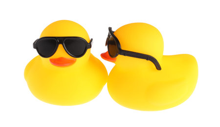 Cute rubber ducks in sunglasses isolated on whiteの写真素材