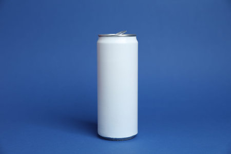 One white tin can on blue backgroundの写真素材