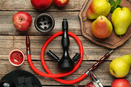 Hookah, coal and fresh fruits on wooden table, flat lay