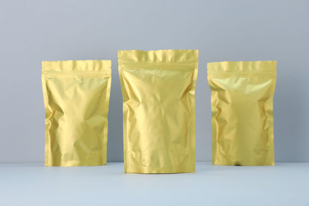 Zipper stand-up pouches on light gray background. Mockup for designの写真素材
