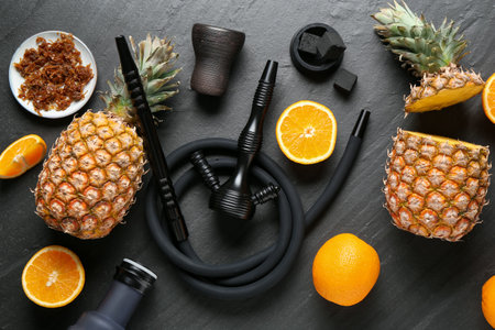 Hookah, coal and fresh fruits on black table, flat layの写真素材