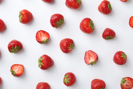 Fresh ripe strawberries on white background, flat layの写真素材