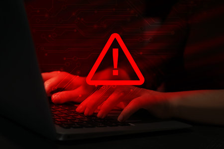 Cyber attack alert notification. Red warning sign, circuit board and photo of hacker using laptop