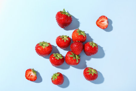 Fresh ripe strawberries on light background, flat layの写真素材