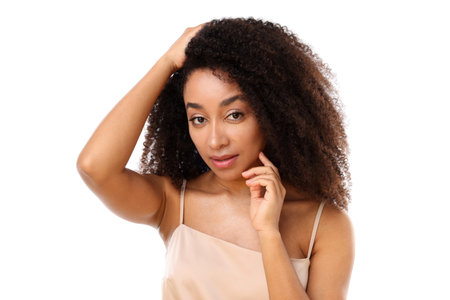 Portrait of beautiful Brazilian woman on white background