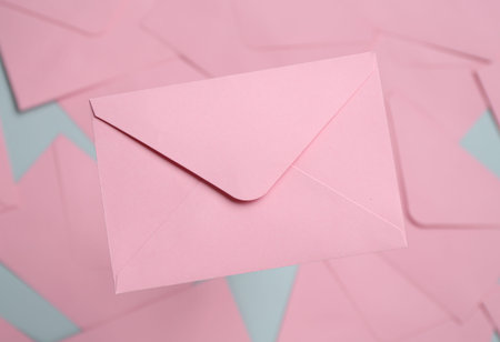 Beautiful invitation envelope on glass surface, top viewの写真素材