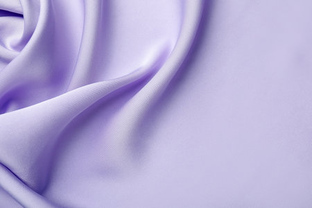 Crumpled violet silk fabric as background, top view. Space for textの写真素材