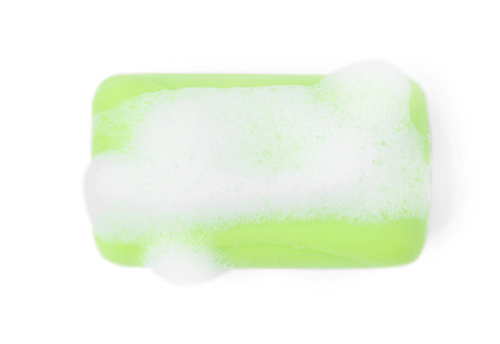 Soap bar with foam isolated on white, top viewの写真素材