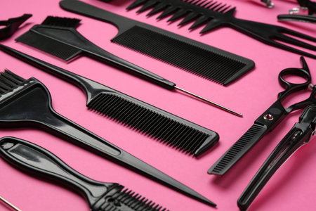 Different hairdresser's tools on pink background, closeupの写真素材
