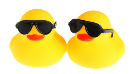 Cute rubber ducks in sunglasses isolated on whiteの写真素材