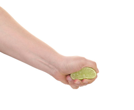 Woman squeezing lime on white background, closeupの写真素材