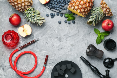 Frame of hookah and fresh fruits on gray table, flat lay. Space for text