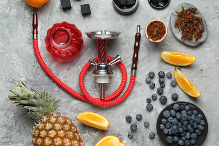 Hookah, coal and fresh fruits on gray table, flat layの写真素材