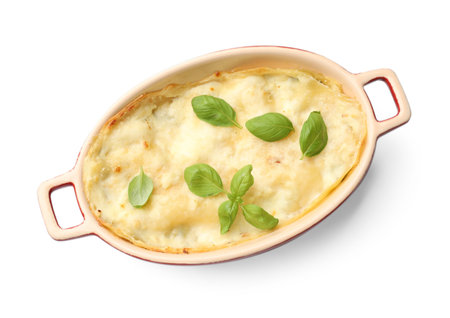 Tasty vegetarian lasagna in baking dish isolated on white, top viewの写真素材