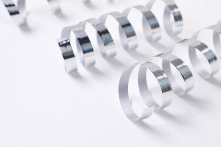 Shiny party streamers on white background, closeupの写真素材