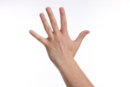 Man showing hand on white background, closeupの写真素材