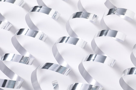 Shiny party streamers on white background, closeupの写真素材
