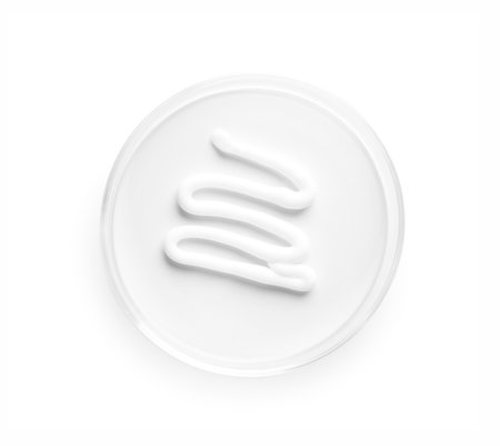 Cosmetic product in Petri dish isolated on white, top viewの写真素材