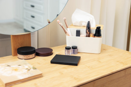 Different makeup products and brushes on vanity indoors, closeupの写真素材