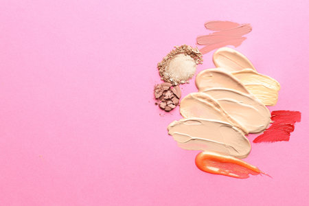 Different cosmetic products on magenta background, flat lay. Space for textの写真素材