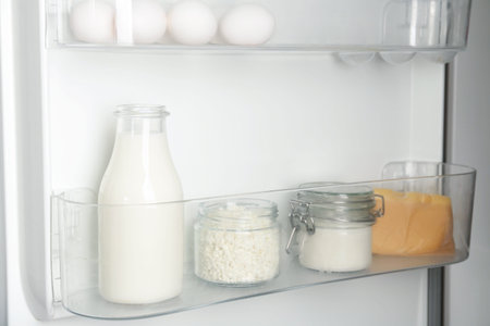 Different dairy products and eggs in refrigerator, closeupの写真素材