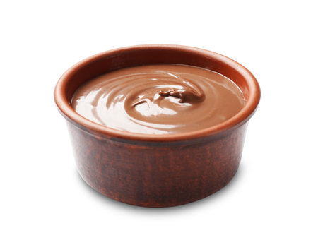 Tasty chocolate butter in bowl isolated on whiteの写真素材